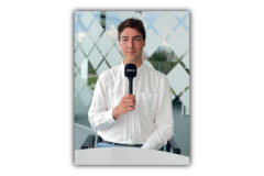 A picture of Matteo holding the microphone.