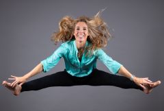 This image shows CODICO's CEO Karin Krumpel jumping in the air.