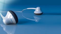 White in-ear-headphones on a blue background.